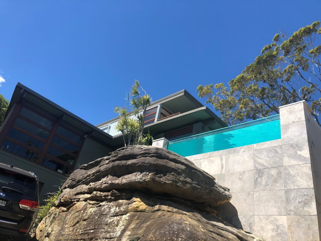 Completed with Ezarri Mosaic waterline and travertine surrounds and Designer Beadcrete